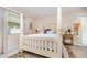 Bedroom with neutral walls and decor, a ceiling fan, and an ensuite bath at 2135 Springwater Ln, Port Orange, FL 32128