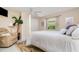 Bedroom featuring a ceiling fan, a plush chair, and natural light at 2135 Springwater Ln, Port Orange, FL 32128