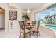 Cozy breakfast nook with views of the pool, tile floors, and a stylish table at 2135 Springwater Ln, Port Orange, FL 32128