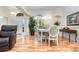 Dining area with bright natural light and hardwood floors adjacent to a seating area at 2135 Springwater Ln, Port Orange, FL 32128