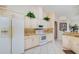 Bright kitchen with tiled floor, white cabinets, and stainless steel appliances at 2135 Springwater Ln, Port Orange, FL 32128