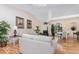 Bright living room with hardwood floors, vaulted ceilings, neutral paint, and seamless flow to dining area at 2135 Springwater Ln, Port Orange, FL 32128