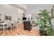 Open living space with dining area, hardwood floors, neutral tones, and plenty of natural light at 2135 Springwater Ln, Port Orange, FL 32128