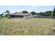 A spacious backyard and a covered patio offer a serene outdoor retreat at 2209 Fairglenn Way, Winter Park, FL 32792