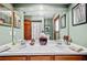 Lovely bathroom with double sinks, white countertops, and green walls at 2209 Fairglenn Way, Winter Park, FL 32792