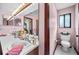 This bathroom features dual sinks, tiled floors, and a toilet at 2209 Fairglenn Way, Winter Park, FL 32792