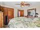 Comfortable bedroom with hardwood furniture and a ceiling fan at 2209 Fairglenn Way, Winter Park, FL 32792