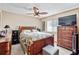 Cozy bedroom features stylish furniture, ceiling fan, and natural light at 2209 Fairglenn Way, Winter Park, FL 32792