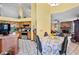 Sunlit eat-in kitchen features wooden cabinets, stainless steel oven and black refrigerator at 2209 Fairglenn Way, Winter Park, FL 32792