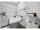 Bright laundry room with white washer and sink, wire shelving, and accessories at 2209 Fairglenn Way, Winter Park, FL 32792