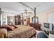 This bedroom has a four-poster bed, a ceiling fan, and plenty of closet space at 2209 Fairglenn Way, Winter Park, FL 32792