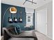 Intriguing bedroom featuring a unique chair and three guitars hung on the wall at 2241 Southbury Dr, Kissimmee, FL 34744