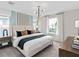 Bright bedroom featuring a large bed, stylish decor, and plenty of natural light at 2241 Southbury Dr, Kissimmee, FL 34744