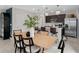 Stylish dining area and kitchen featuring modern finishes, stainless steel appliances, and an island with seating at 2241 Southbury Dr, Kissimmee, FL 34744