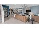 Open-concept living space featuring tile floors, modern lighting fixtures, comfortable seating and a staircase at 2241 Southbury Dr, Kissimmee, FL 34744