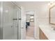 Ensuite bathroom featuring a glass shower and modern vanity at 235 Aidans Lndg, Haines City, FL 33844