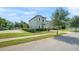 Lovely two-story home with manicured landscaping and an attractive brick-lined sidewalk at 235 Aidans Lndg, Haines City, FL 33844