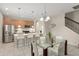 Bright open-concept kitchen with stainless steel appliances and a large island with counter seating at 235 Aidans Lndg, Haines City, FL 33844
