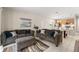 Spacious living area featuring comfortable seating, and an open layout to the kitchen and dining at 235 Aidans Lndg, Haines City, FL 33844