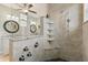 Custom shower featuring multiple shower heads and tile walls and double vanity with granite countertops at 291 River Rd, Oak Hill, FL 32759