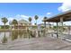 This dock has a covered boat lift for easy water access and access to the main house at 291 River Rd, Oak Hill, FL 32759