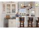 Kitchen with bar-style seating, granite countertops, stainless appliances, and decorative lighting at 291 River Rd, Oak Hill, FL 32759