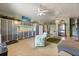 A versatile living area with storage, a golf putting green, and comfortable seating at 291 River Rd, Oak Hill, FL 32759