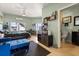 This cozy living room features a daybed, a TV, and an adjacent bathroom at 291 River Rd, Oak Hill, FL 32759