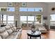 Waterfront living room with plenty of natural light and access to the outdoor deck at 291 River Rd, Oak Hill, FL 32759