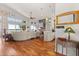 Spacious living room featuring hardwood floors and expansive windows with waterfront views at 291 River Rd, Oak Hill, FL 32759
