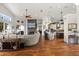 Open-concept living space with hardwood floors, fireplace, and modern kitchen at 291 River Rd, Oak Hill, FL 32759