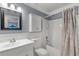 Bathroom featuring a vanity, mirror, lighting, toilet, and shower with a shower curtain at 3055 Dellcrest Pl, Lake Mary, FL 32746