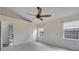 Spacious bedroom with tile floors, a ceiling fan, and natural light from the windows at 3055 Dellcrest Pl, Lake Mary, FL 32746
