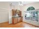 Dining area with custom cabinets, hardwood floors, and a large window at 3055 Dellcrest Pl, Lake Mary, FL 32746