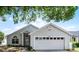 Charming single-Gathering home featuring a two-car garage, manicured lawn, and beautiful curb appeal at 3055 Dellcrest Pl, Lake Mary, FL 32746