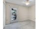 A well-lit living room boasts light walls, tile flooring, and a door showing a furnished outdoor patio at 3055 Dellcrest Pl, Lake Mary, FL 32746