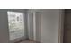 Bedroom features neutral carpet, large window, and spacious closet at 315 Wymore Rd # 104, Altamonte Springs, FL 32714