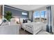 Bright bedroom features cool blue decor, large window, and white furniture providing a serene space at 3346 Wakefield Dr, Haines City, FL 33844