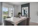 Bright and inviting dining area with large window, and view to living space and kitchen at 3346 Wakefield Dr, Haines City, FL 33844