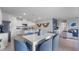 Dining area flowing into the kitchen, featuring a large table with seating for six at 3346 Wakefield Dr, Haines City, FL 33844