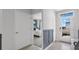 Bright entryway with neutral tones, views of bedroom, and a door to the outside at 3346 Wakefield Dr, Haines City, FL 33844