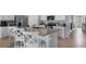 Stylish eat-in kitchen with stainless appliances, a center island and views to living area at 3346 Wakefield Dr, Haines City, FL 33844