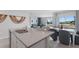 Open-concept living and dining space with stylish decor, flowing from kitchen into living area at 3346 Wakefield Dr, Haines City, FL 33844