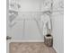 Spacious walk-in closet with ample shelving and storage, designed for organization and convenience at 3346 Wakefield Dr, Haines City, FL 33844