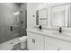 A modern bathroom with a glass shower and double sinks at 3420 Sw 130Th Lane Rd, Ocala, FL 34473