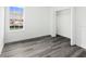Bedroom features luxury vinyl flooring, a window, and a closet space at 3420 Sw 130Th Lane Rd, Ocala, FL 34473