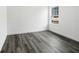 Bedroom featuring wood-look floors and a window providing natural light at 3420 Sw 130Th Lane Rd, Ocala, FL 34473