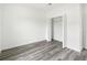 Bedroom with wood-look floors and closet at 3420 Sw 130Th Lane Rd, Ocala, FL 34473
