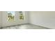 Bright bedroom with two windows and luxury vinyl flooring at 3420 Sw 130Th Lane Rd, Ocala, FL 34473