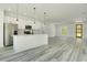 Bright kitchen with island, stainless steel appliances and an open living space at 3420 Sw 130Th Lane Rd, Ocala, FL 34473